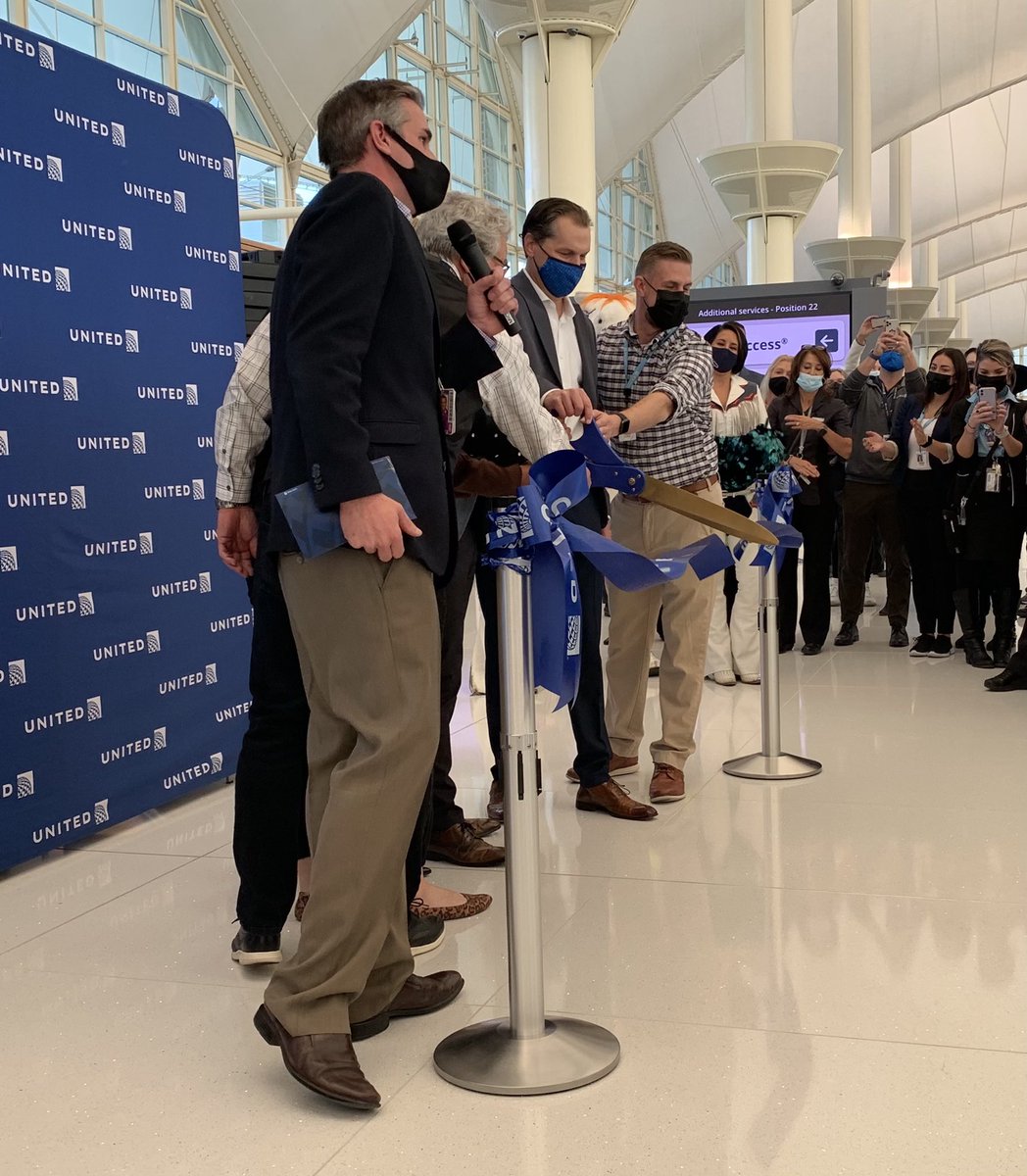 puddincat3's tweet photo. Worth the wait!  Ribbon cutting in our fabulous new Denver lobby.  Going the extra mile with Miles in the mile high city.  Proud of this United team!#beingunited @ItstheKenster @SarahHCassidy @GrewalMandee @Tobyatunited @jonathangooda @MattatUnited https://t.co/E7Delnlc2i