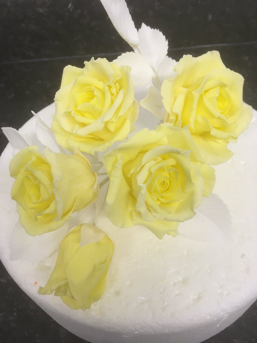 A group of sugar roses wired up to be placed on a cake. #sugarflowers #sugarroses #porshamcakes #cake #devonweddings #weddevon #handmade #craft #luxurycakes