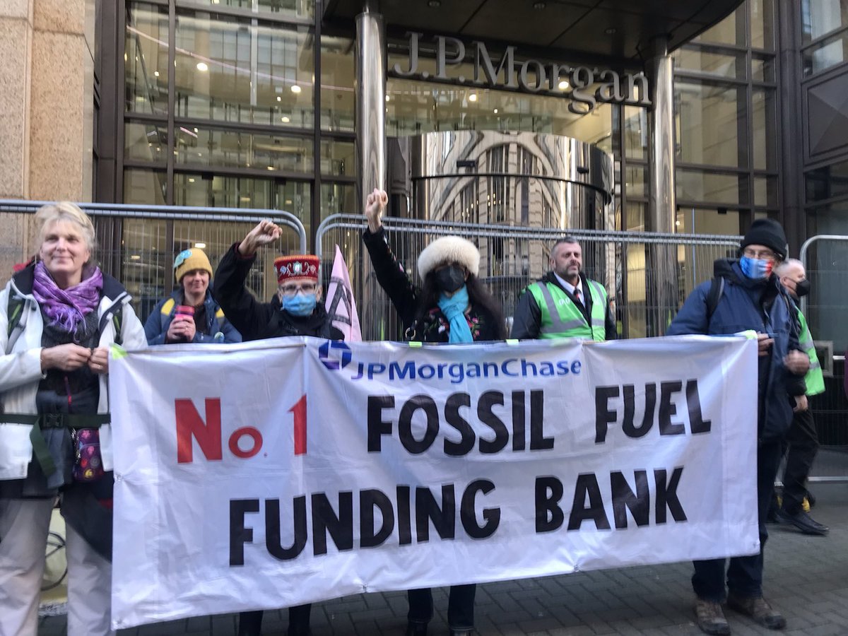 IENearth's tweet photo. Earlier today Indigenous leaders at the #COP26 held an action outside the @jpmorgan @Chase bank in Glasgow, UK calling out the bank for its role as the largest financier of fossil fuels worldwide! #DivestFromFossilFuels #NoTarSands https://t.co/foqviUDfLA