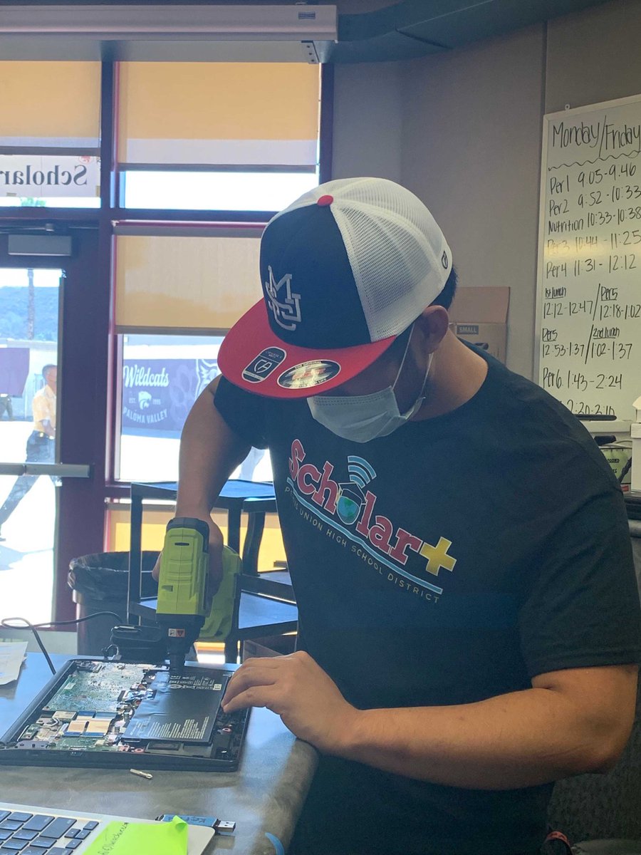 Our techs working hard sporting College gear for College Wednesdays