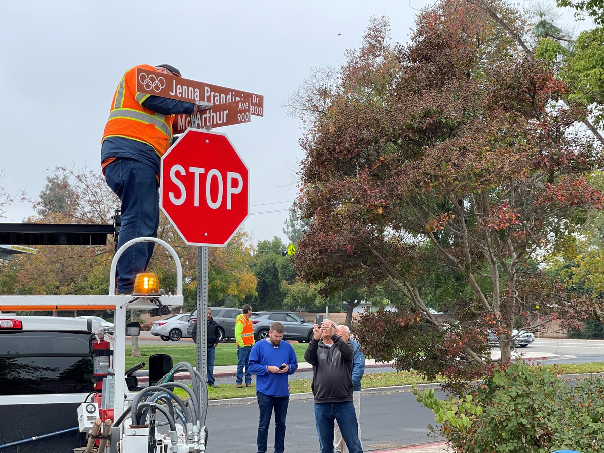 CityofClovisCA's tweet photo. It’s official! A City of Clovis work crew replaced the signs on Wrenwood Ave. Wednesday morning, just north of Clovis High School, changing the name of the street to Jenna Prandini Drive. Clovis native Jenna Prandini won a silver medal in the 4 X 100 relay at the Tokyo Olympics. https://t.co/ISXFqPUvW6