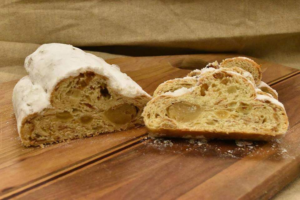 Dresdner Stollen
Our signature holiday treat. A German bread cake filled with rum soaked golden raisins, almonds, orange peel and pure marzipan.  We brush it with butter while still warm and top it with powdered sugar. #bakery #local #Fresh