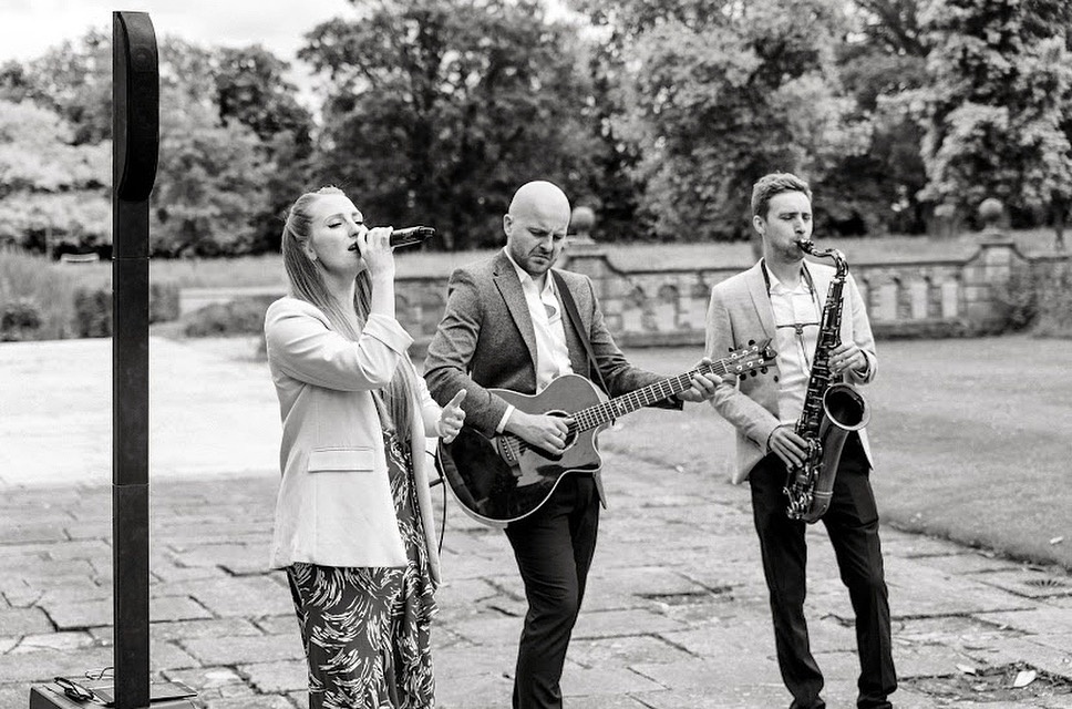 Our trio performing at an outdoor drinks reception in August. Our totally wireless systems means we can set up anywhere in the world!