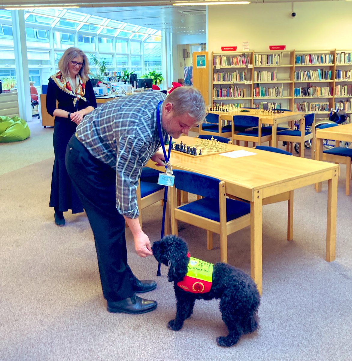 TrinityCroydon's tweet photo. Itβs always lovely to have a visit from Lily and Brian from @dogaid, creating an atmosphere of calm in the library #TrinityLibrary https://t.co/IPGluyMGop