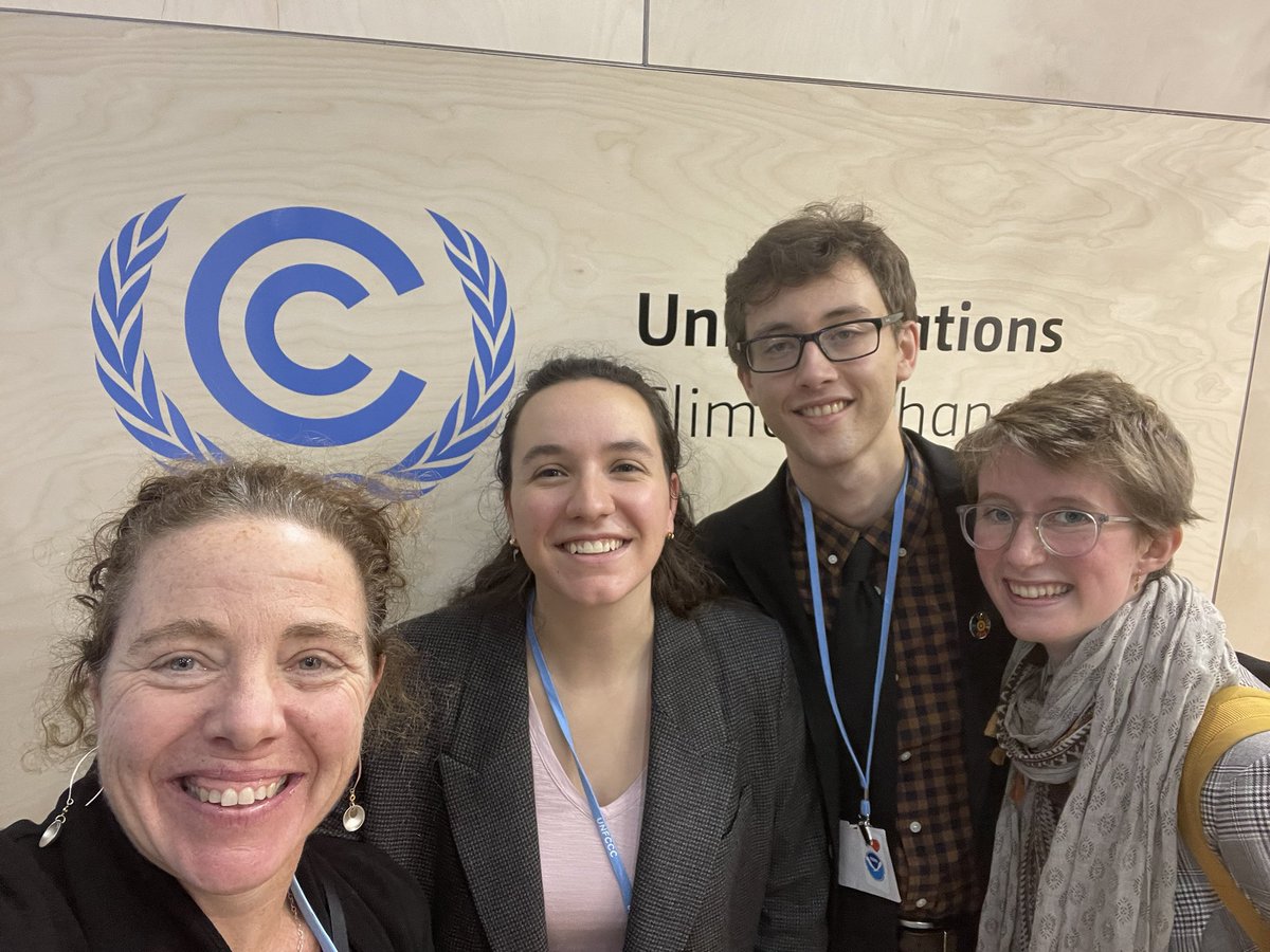 Wild center delegates standing in front of a UN sign.