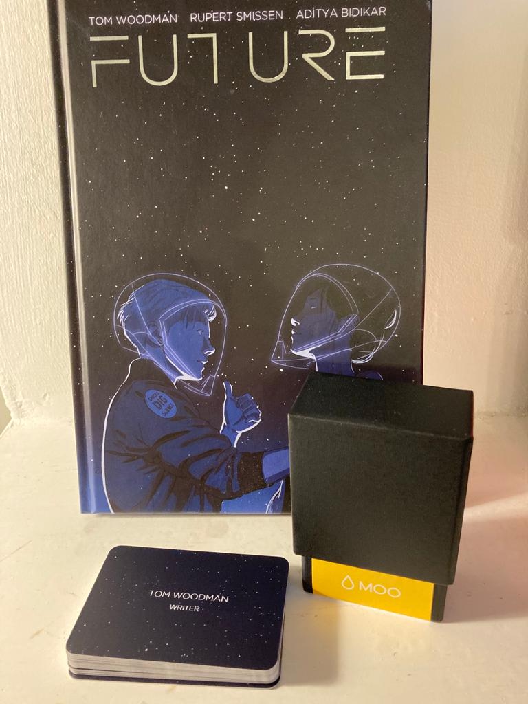 TomMayoWoodman's tweet photo. @Moo absolutely killed it with these business cards, here stylishly modelled alongside @ComicPrintingUK's beautiful print of @FutureTheComic.

Onward, to Thought Bubble! #TBF21

#comics #comicbooks #books #graphicnovels #harrogate #freelancer https://t.co/WJc43ocFGH
