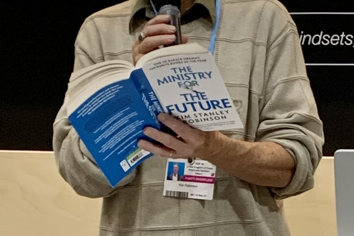 Koko_Warner's tweet photo. Kim Stanley Robinson reading #MinistryForTheFuture at #ResilienceLab #CarbonCoin #climatefinance @COP26 @UNFCCC @ynassef @weisbergm https://t.co/oUHxk6Elld