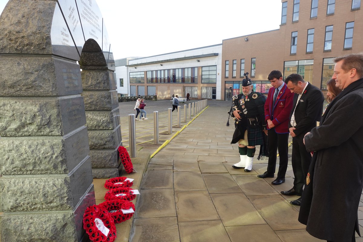 HC_Scotland's tweet photo. Headteacher Mr Charman, Head Girl Heather and Head Boy Luke visited the War Memorial in Hamilton this morning, to mark Remembrance Day by paying their respects and remembering those lost in conflict.

#HamiltonReflection https://t.co/exwaX8bKnr