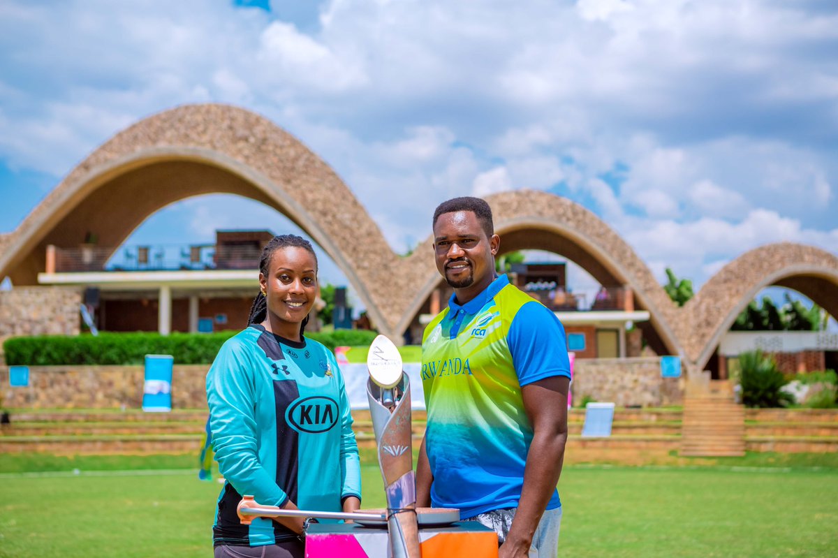 RwandaCGA's tweet photo. #QBR2022: Two Rwandan cricket players and Guiness World Record Holders Cathia Uwamahoro and Eric Dusingizimana posing next to the Queen’s Baton at Gahanga Cricket Stadium. #QBR2022InRwanda #B2022 https://t.co/UHURyMGbF9