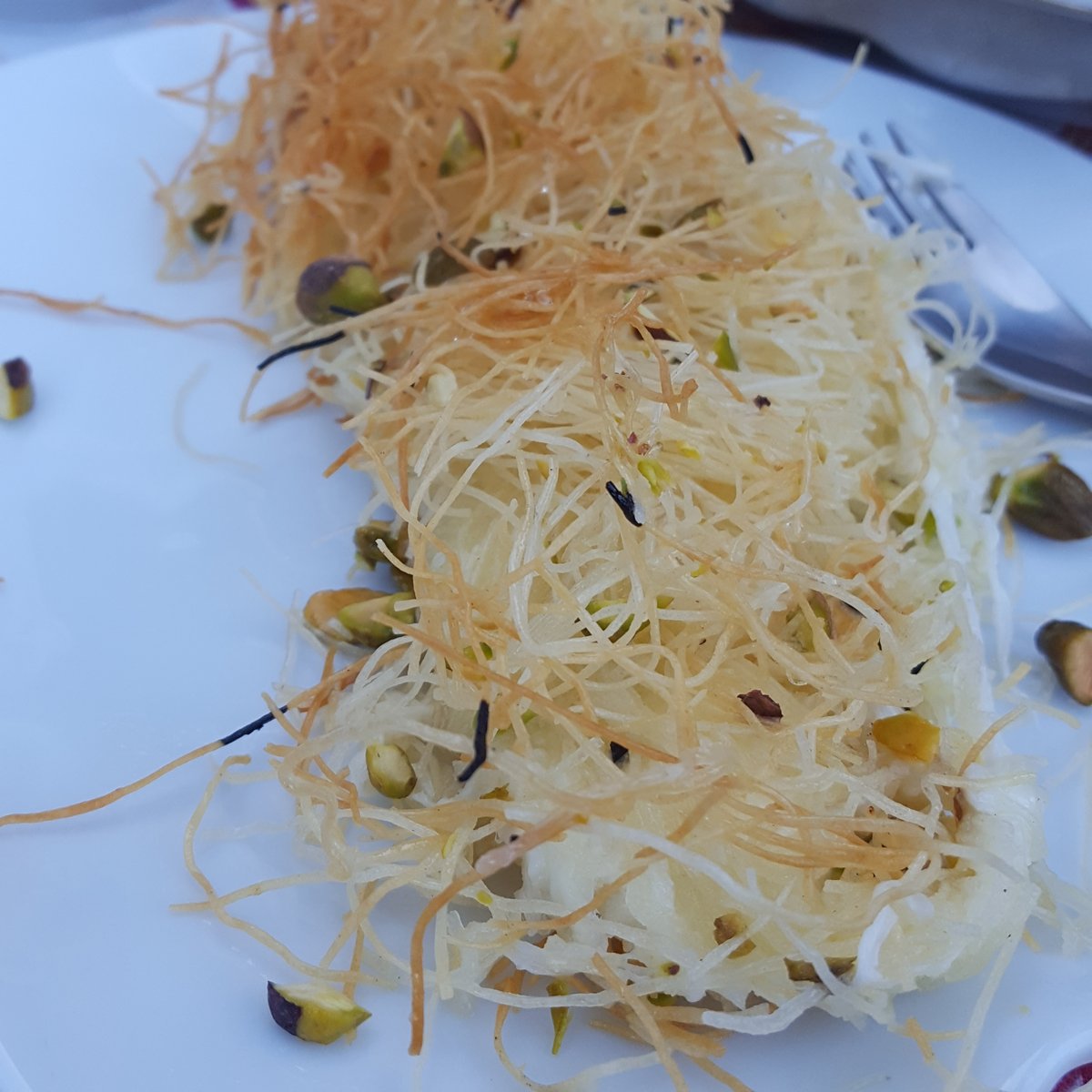 acraftyarab's tweet photo. I love love love having dinner in a Palestinian home, as I always know what comes at the end.
#kanafa https://t.co/47p2Kasrgu