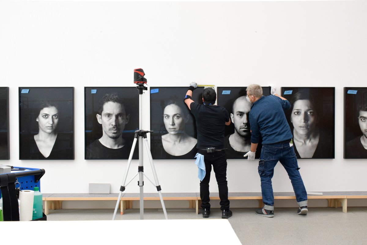 Pinakotheken's tweet photo. #PinaShirinNeshat In unserer Ausstellung SHIRIN NESHAT. LIVING IN ONE LAND, DREAMING IN ANOTHER zeigen wir ab 26.11.2021 mehr als 200 Fotografien in der #PinakothekDerModerne. Möglich machen es die vielen fleißigen Hände in unserem Team. #makingof 💪 https://t.co/RiTyDI9e74 https://t.co/NFCytkNJPA