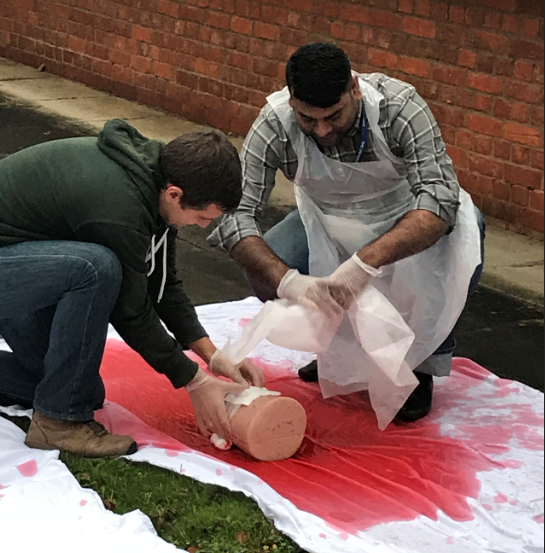 UoB_medic's tweet photo. Practicing tying a tourniquet can be a messy experience! Day two of our First Aid Response Course. Book to attend yourself in January or March 2022: https://t.co/cbkqKGEpmc #firstaidtraining https://t.co/RRx0RPRRdJ