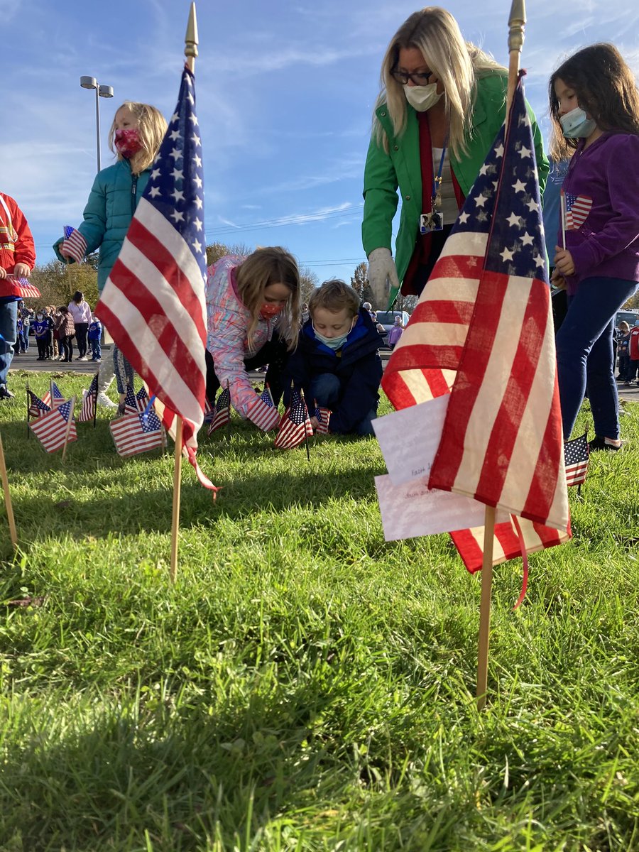 GowandaCSD's tweet photo. Students places American flags on the lawn of Gowanda Elementary School in observance of Veterans Day 2021 before assembling in the parking lot to sing "Thank you, Soldiers." 🇺🇸❤️🤍💙

#PantherPride #GowandaCSD #VeteransDay2021 

@CarrieDzierba @TheObserverNY @WDOEnews @NYSEDNews https://t.co/f8YtAsvJnr