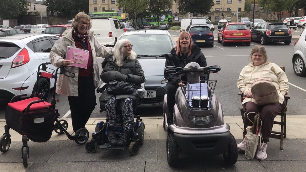 BBCLookNorth's tweet photo. Protesters locked in battle over benches with bosses at Bramley Shopping Centre hand petition to city council: https://t.co/WJsg7mqkDx https://t.co/eBa2bqaRna