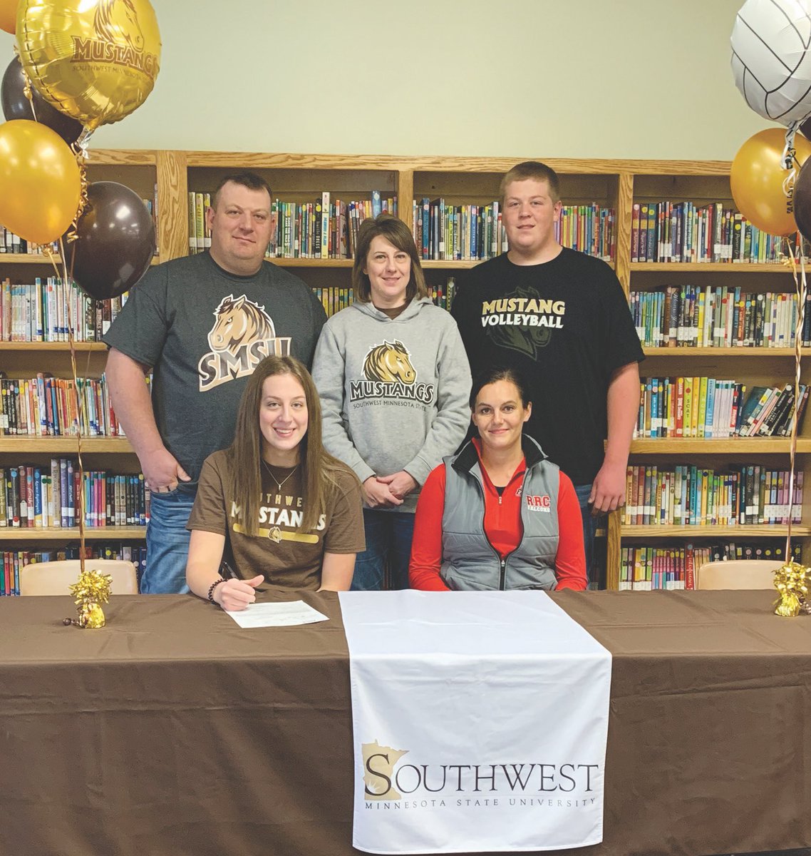 Karli Arkell signing her letter of intent to play volleyball for smsu