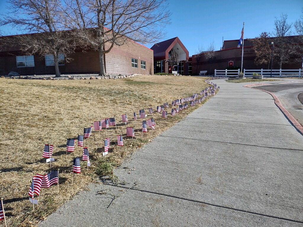CCECoyote's tweet photo. To all those that have and are serving our great country - thank you! Students at CCE placed flags with names all around the school. https://t.co/uJusnJtZuy