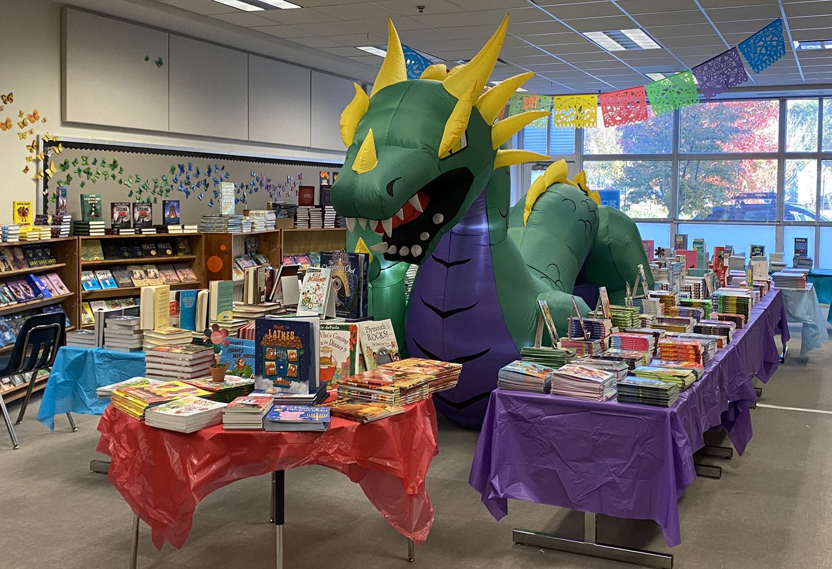 BowsherKimberly's tweet photo. Book Fair started today. 
📚🐉❤️
Parent volunteers did an excellent job with the theme.
#RiversElementary #APS #Books #Reading 
@riverslionsroar @JohnWallerEdD @melsithole @apsupdate @dan_a_sims @DrLisaHerring https://t.co/bmJ1k8T5D1