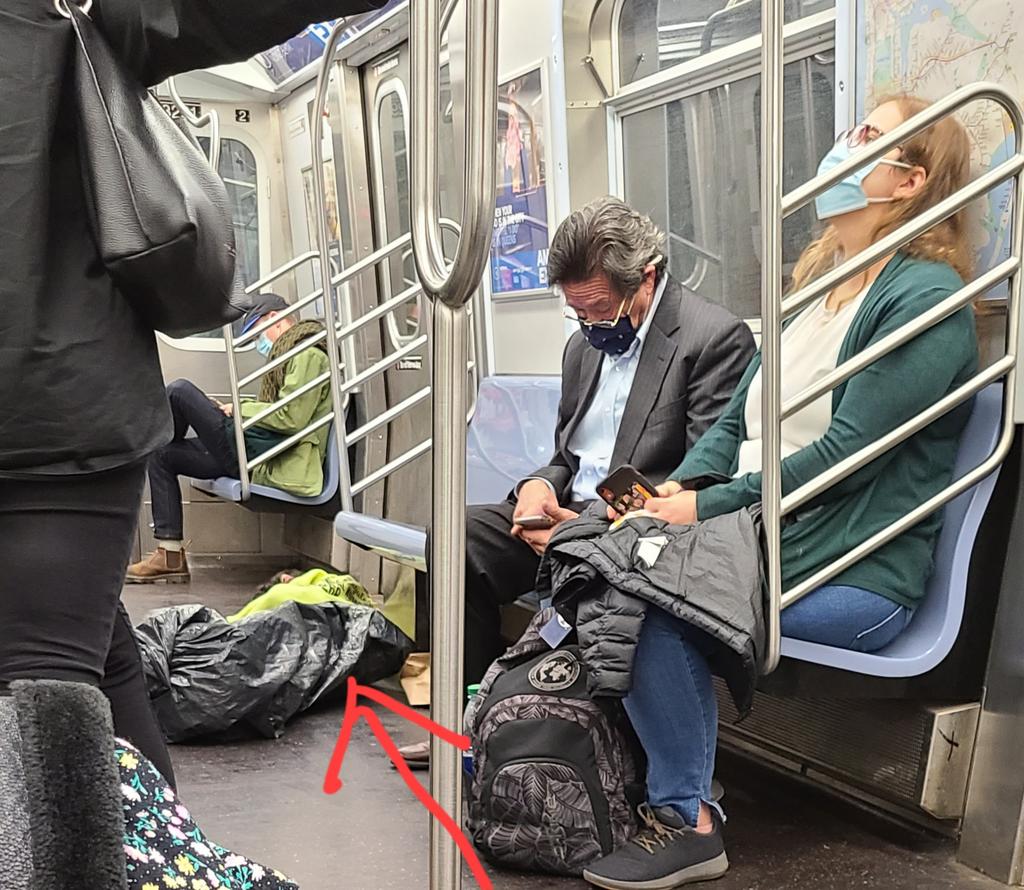 MarianaByDesign's tweet photo. @NYCTSubway An hour now, to go ONE stop on the A train due to ??? Mumbles the conductor is incomprehensible. Nice to know our tax dollars STILL not at work. Someone is openly sleeping in the floor of the train now. #MTAfail. This isn't even the first A-train fail like this today https://t.co/u9lBLAE3s2