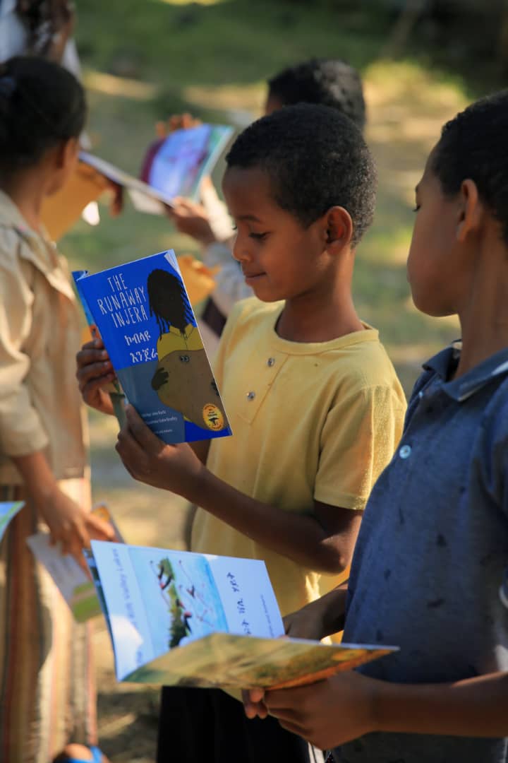 EthiopiaReads's tweet photo. The Runaway Injera by @JaneKurtz brings a smile to a boy displaced by conflict to Ataye in North Shewa. Our team distributed packets of @OpenHeartsBigD1  books and engaged parents on the value of reading to support education. Thks @WB_Ethiopia @WBG_Education &amp; @YaredShumete https://t.co/trKkqMFNMe