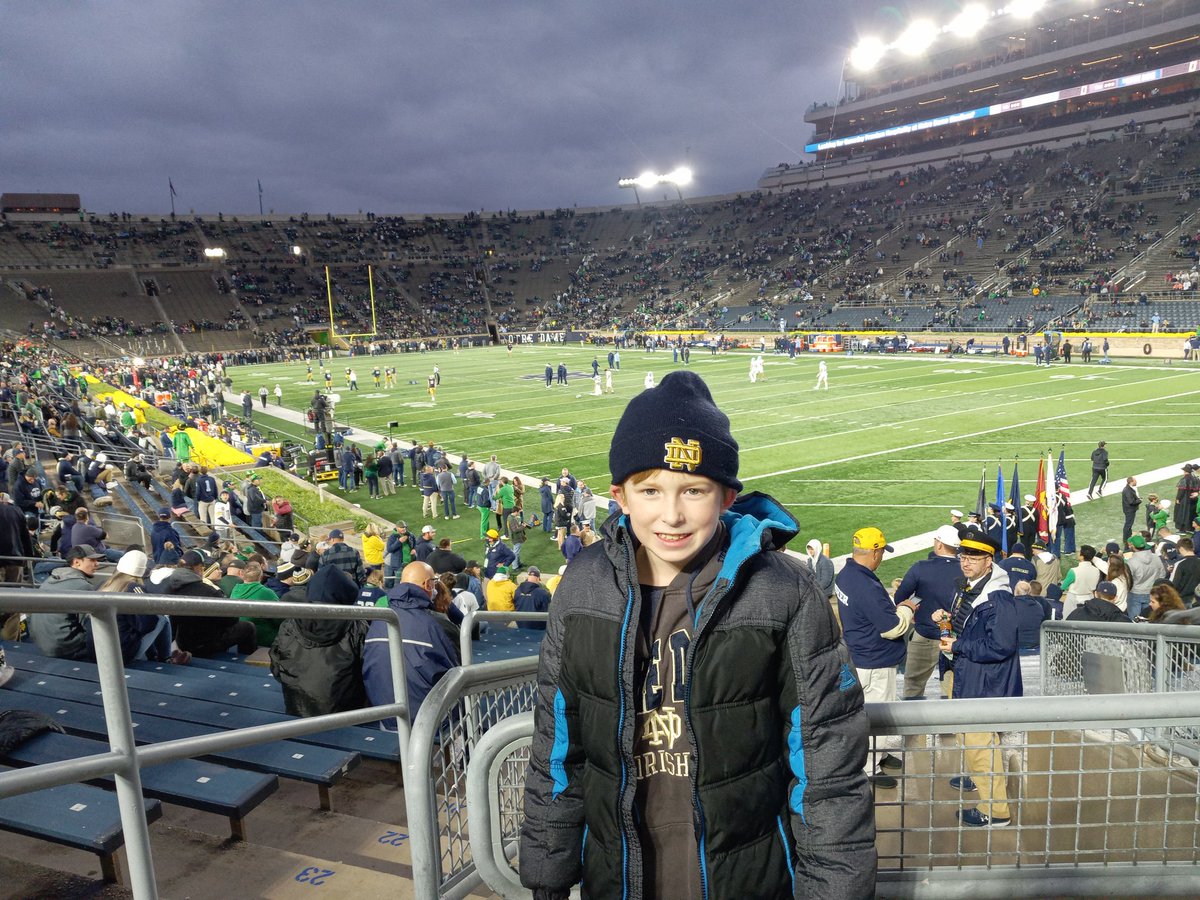 PrahlCISScience's tweet photo. @NDFootball Took my 8 year old son to his first ND football game! He had so much fun. He said, "I want to get a pair of ND football gloves so I can catch the football at recess. He has trouble catching the ball but believes these will make the difference:) Checkd bookstore.NoLuck https://t.co/IXvGRh3YmB