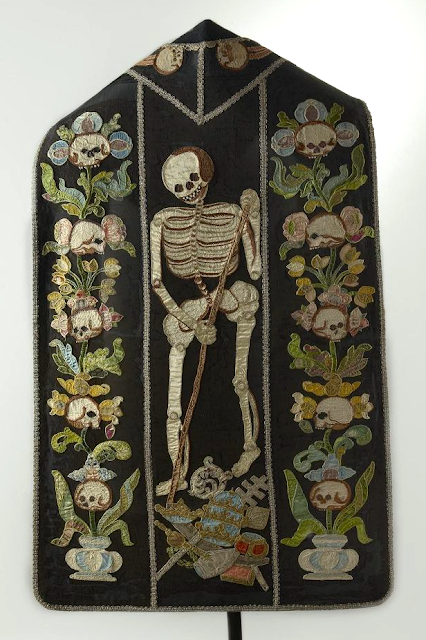 IsabellaRosner's tweet photo. Happy Halloween! I'm celebrating with my favourite pieces of historic memento mori needlework: a 17th-century Dutch needlework picture (with "today for me tomorrow for you" in Latin), a 16th-century glove, and an undated chasuble (maybe 18th century?). Spooky skeletons for all! https://t.co/b2XWhaBnUm