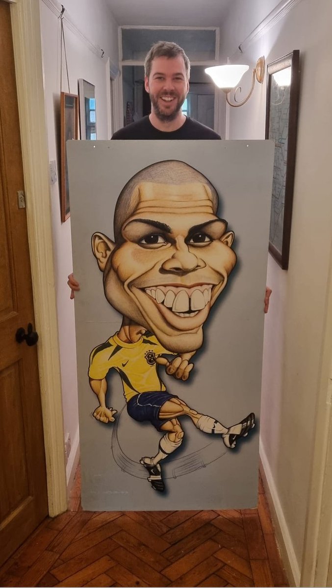 I was working part-time at all:sports in Sutton during the 2002 World Cup and pinched a massive Ronaldo caricature when the window display ended. 

It's still propped up against a wall in a spare room at my mum's place. Was obviously done before he had the little triangle hairdo.