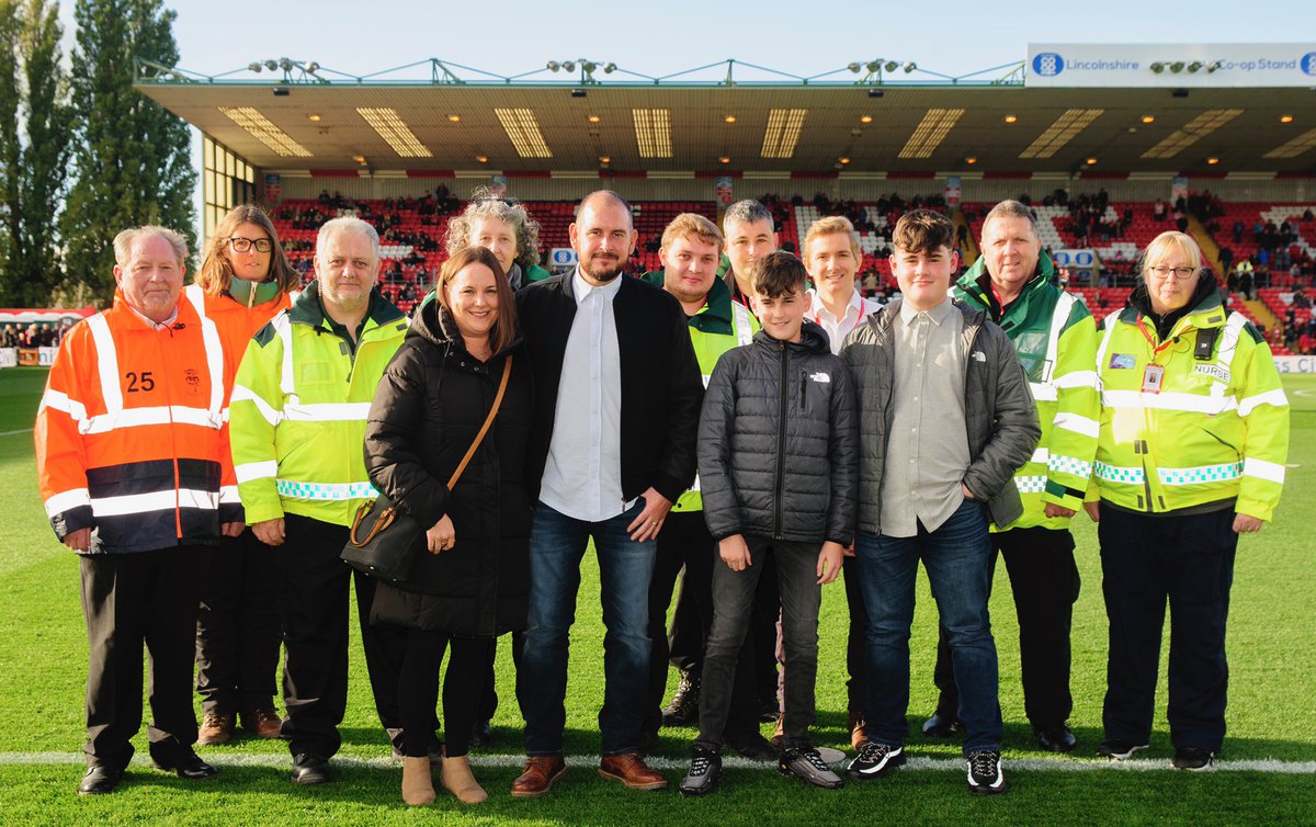 LincolnCity_FC's tweet photo. Imps fan Stuart Dye was a guest in the boardroom on Saturday for his first match back after suffering a heart attack at a game earlier this season.

Stuart and his family had a chance to meet the medical staff who saved his life and thank them for their efforts ❤️ https://t.co/U9HpctKqUY