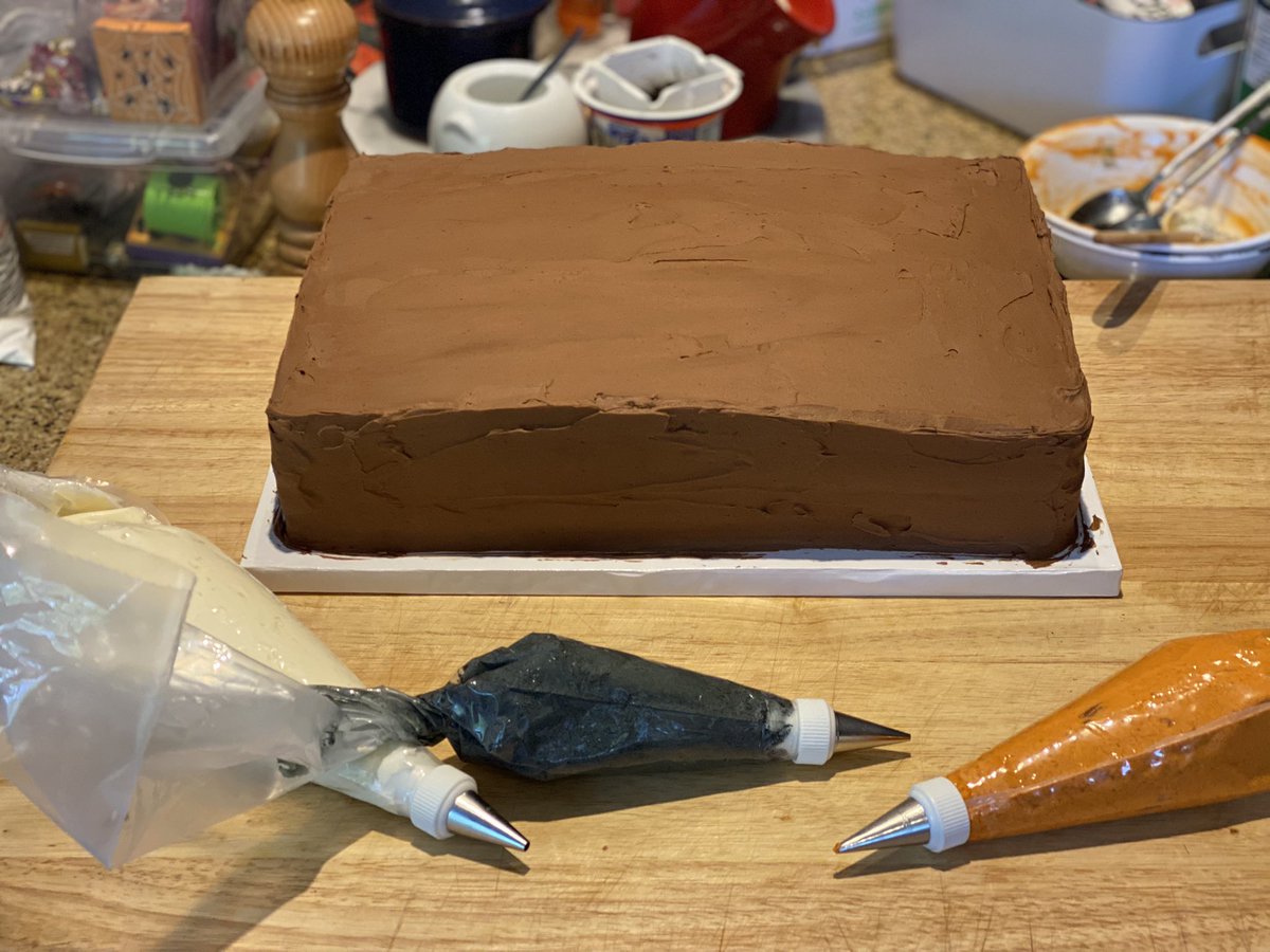 the_money_pit's tweet photo. Triple layer Halloween birthday cake: chocolate layers filled with strawberry jam and spooky decorations. https://t.co/b8EBixX5lk