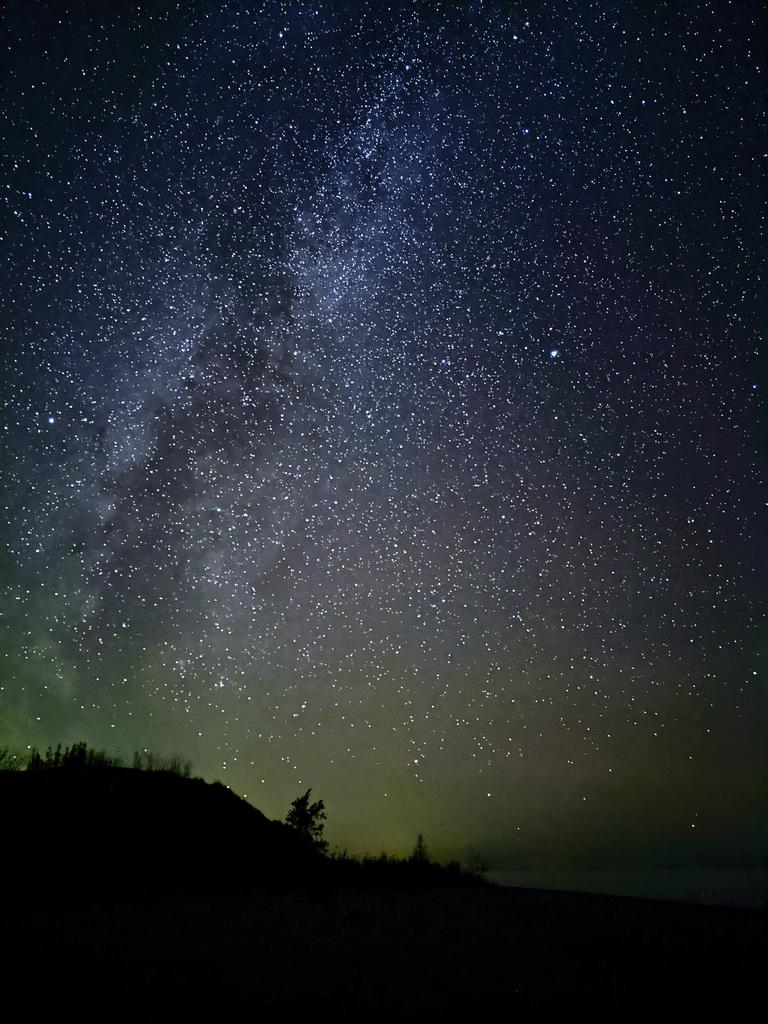 milimathews's tweet photo. Drove 5 hours to catch a glimpse of the #NorthernLights last night. Pretty bummed that the #Auroras were a no show, but my @Google Pixel did capture some stunning shots of the #MilkyWay. 
.
.
@PeterVogel I see a faint green glow in some of these pictures. What do you think? https://t.co/C7JF53XQFh