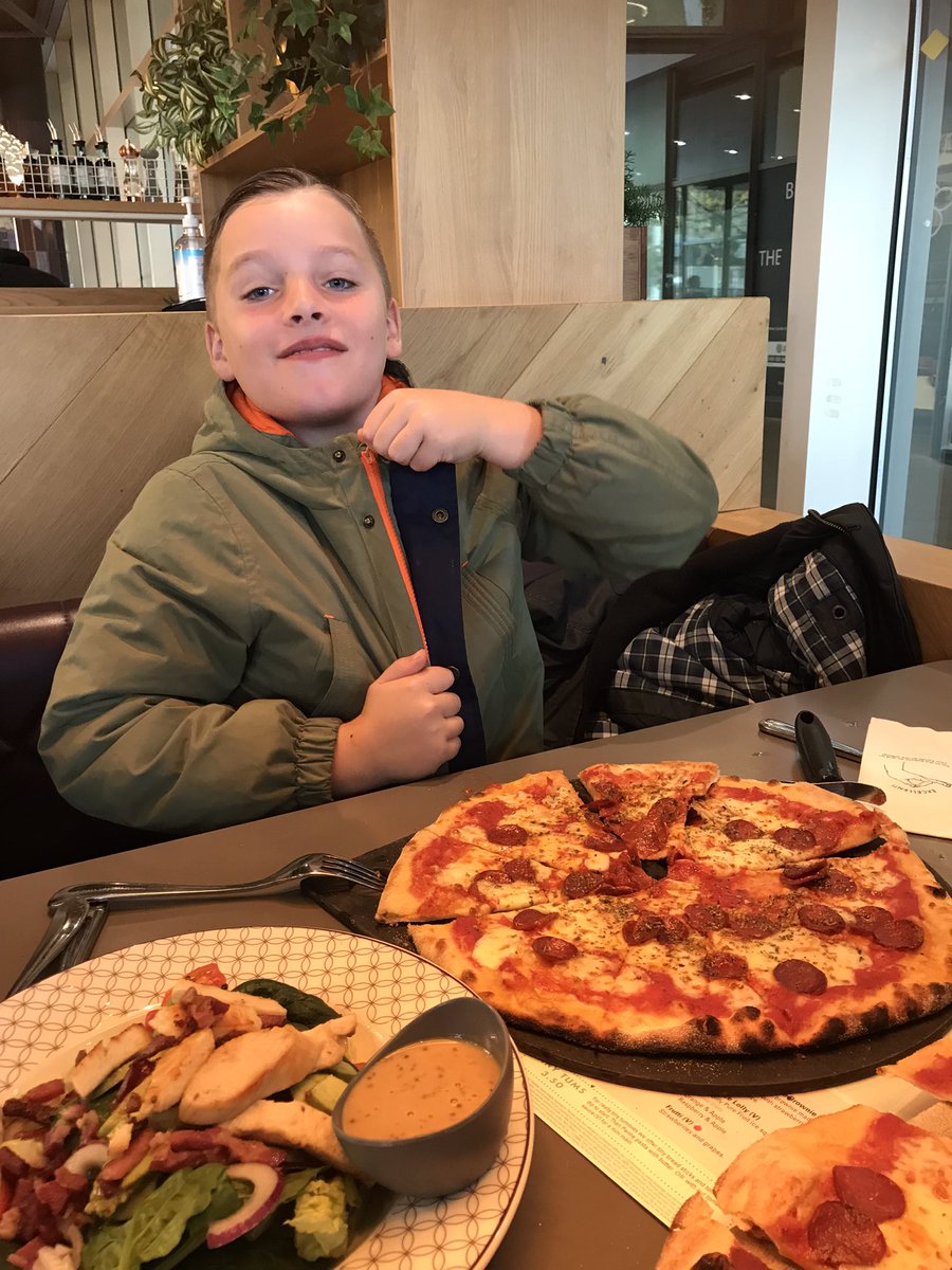 sambevan6's tweet photo. Eating pizza with his coat on so he doesn’t get any on his new @JackGrealish top @ManCity https://t.co/Y6cBBfq0sP