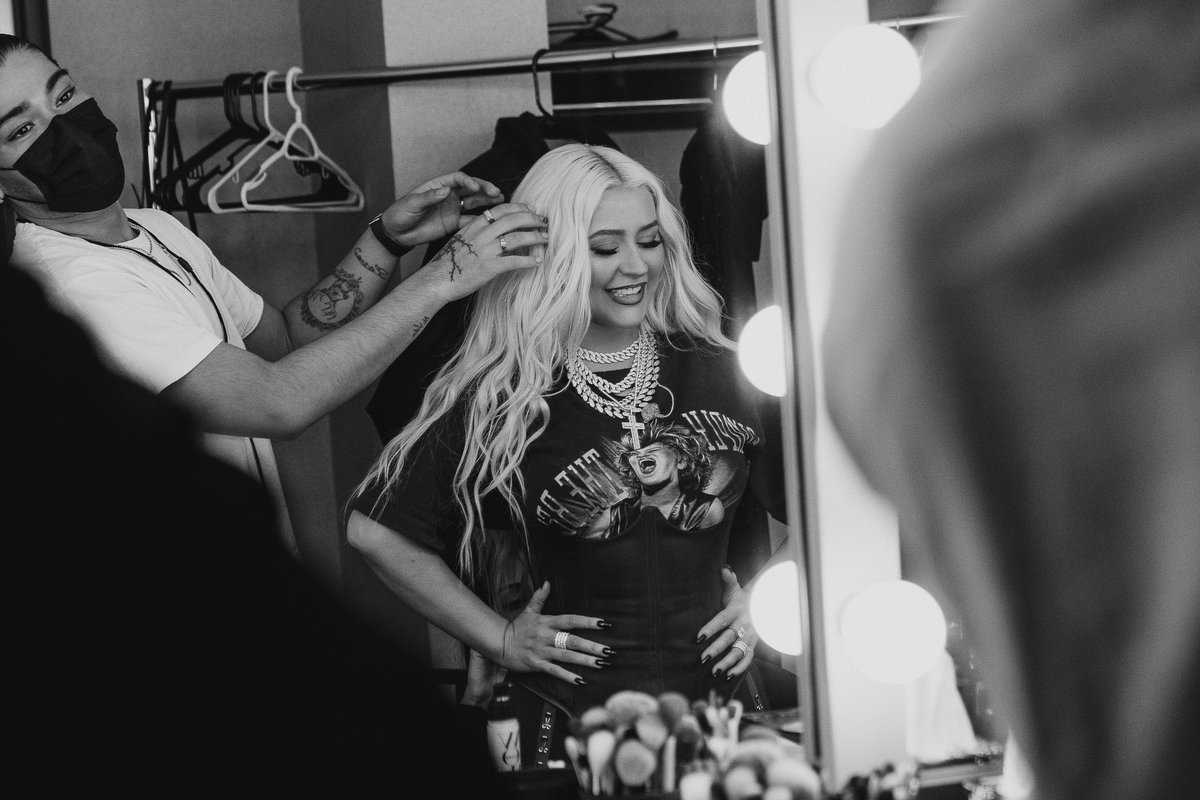xtina's tweet photo. It was an honor celebrating the iconic Tina Turner at the Rock &amp; Roll Hall Of Fame last night!! ❤️ Congratulations to all of the 2021 inductees on your incredible achievements 💋 https://t.co/xE151EOEPI
