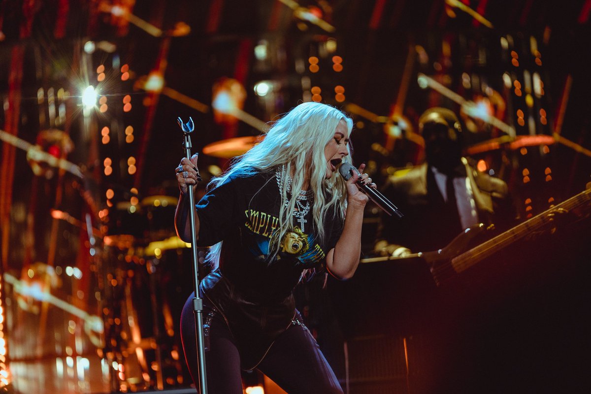 xtina's tweet photo. It was an honor celebrating the iconic Tina Turner at the Rock &amp; Roll Hall Of Fame last night!! ❤️ Congratulations to all of the 2021 inductees on your incredible achievements 💋 https://t.co/xE151EOEPI