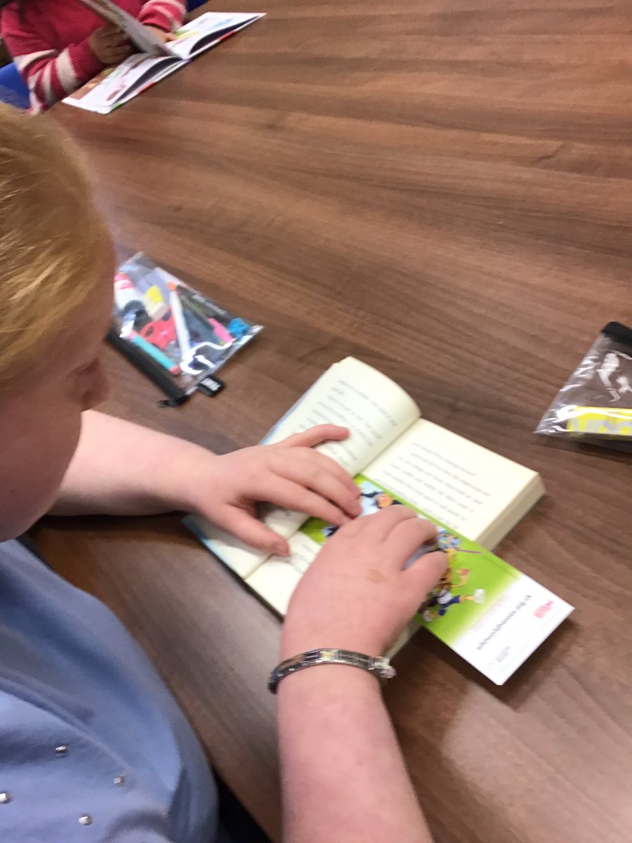 P3 reading our reading books we got from the library