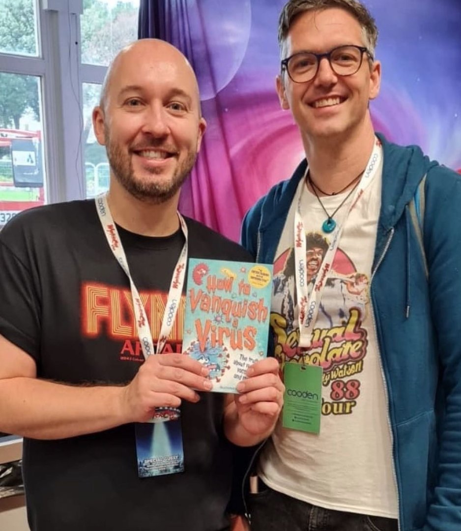 speckledpen's tweet photo. @DrPaulScience & @SteveSketchesIt met in real life at #ComicCon with their book HOW TO VANQUISH A VIRUS, published by @KidsWelbeck. How exciting! #howtovanquishavirus #NonfictionNovember https://t.co/WS9iGZexUn