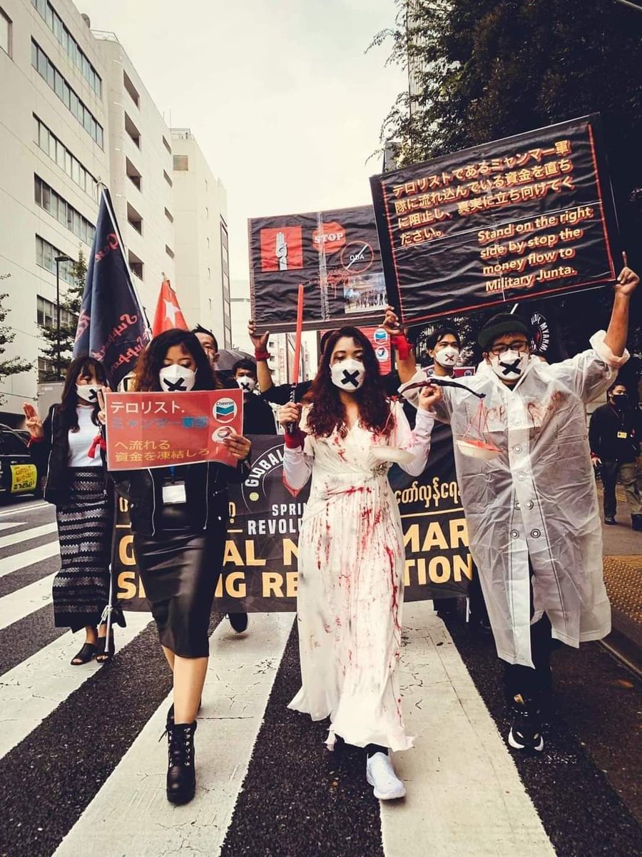 Chanapai247's tweet photo. Even under the rain , Burmese community in #Tokyo of Japan completed #BloodyMoneyMyanmar campaign movement calling on @TotalEnergies , @Chevron and #POSCO to end up payments to SAC .

MYANMAR NEEDS HELP
#Nov1Coup
#WhatsHappeningInMyanmar https://t.co/XjqIgRDJ3A