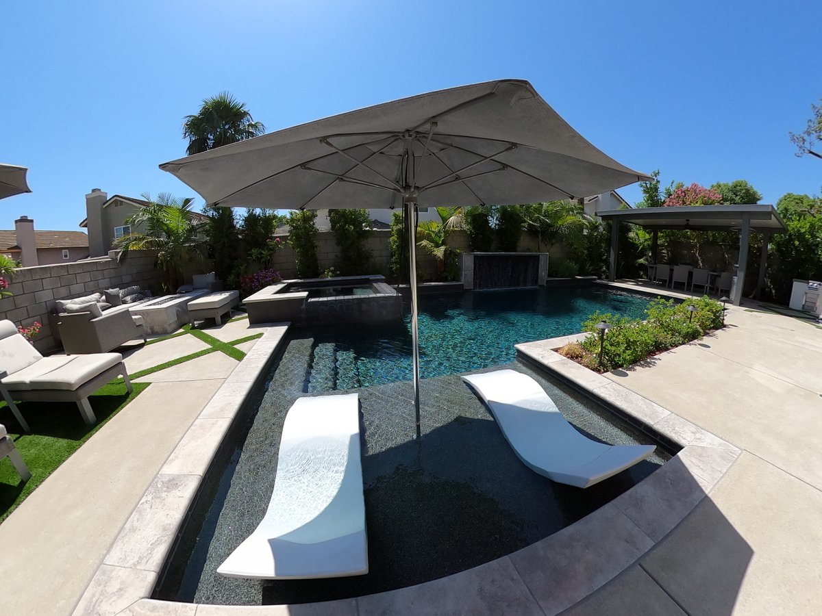 GotSplash's tweet photo. Let’s create a backyard that uses your available space wisely, like this beauty! Plenty of room for family fun including a pool, spa, lounging area and patio cover. 
.
.
#pooldesign #swimmingpool #luxurypools #backyarddesign https://t.co/OdVxfuaNoY