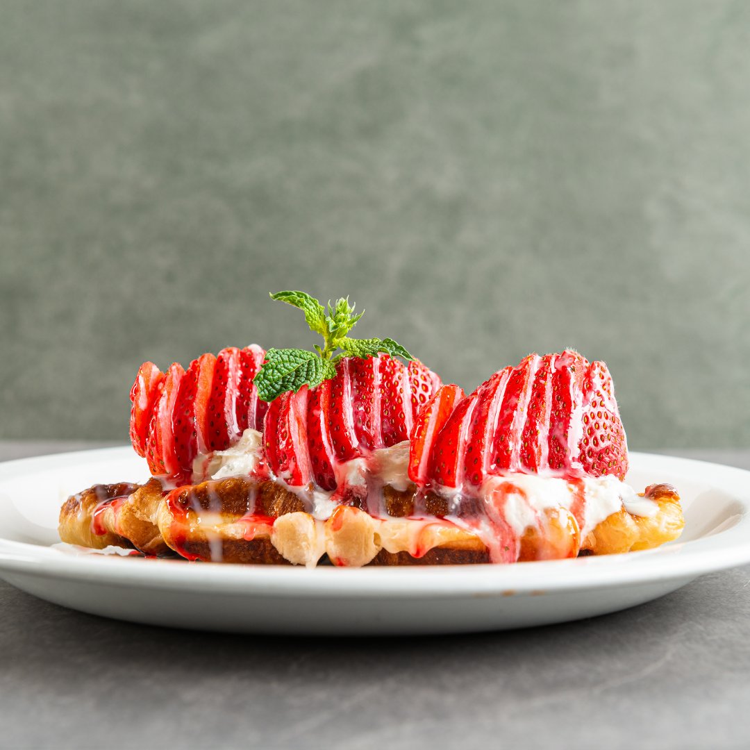 DenBlackLounge's tweet photo. Blessing your feed with our Taiwanaese Croissant Waffles. Get a taste of delicious sugared croissant dough, topped with vanilla cream, fresh strawberries, raspberry coulis, and of course condensed milk drizzle. 

#TheDen #DenBlackLounge #ucalgary #yyc #yyceats #calgary https://t.co/WjoYl77sAy