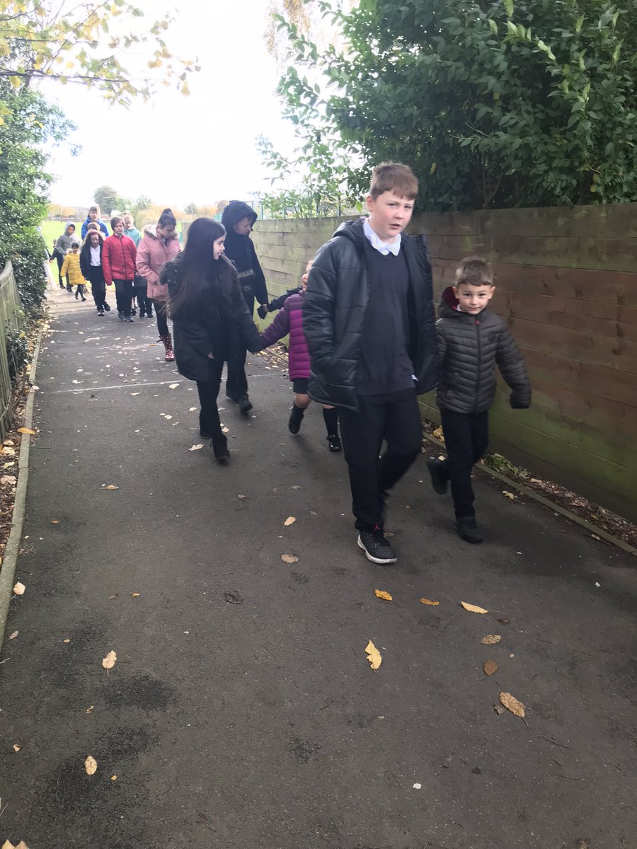 P7 and P1 walking smartly to church to celebrate the Feast of All Saints  #buddies #communityoffaith