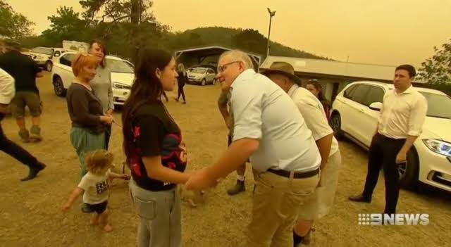 this man has a creepy habit of touching people in a familiar way without consent… all for the camera.