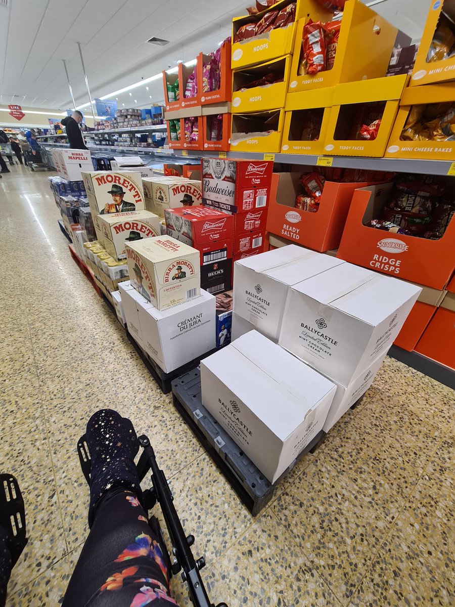 fizliz20's tweet photo. Every week I inform @AldiUK about the St Neots store being cluttered, blocking wheelchair users, every week I'm told they tell the store manager. Those squash bottles are unsafe & could fall out & hit a child or wheelchair user. I couldn't get to one aisle as u can see. #aldifail https://t.co/bHpEzrSmuQ