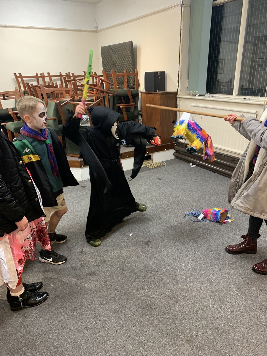 ASJScouts's tweet photo. Cubs had a spooktacular time tonight with our Day of the Dead celebrations. We decorated masks, tried some delicious Mexican inspired food and learned about the traditions behind it. We also played outdoor games, made s’mores on the campfire and played piñata! #scouts https://t.co/dIa64WT2gs