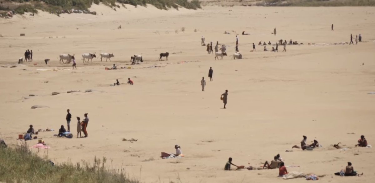 PGDynes's tweet image. No this isn’t people sunning themselves on a beach…these are desperate people digging in what used to be a river looking for water - birds eye river view also.. #Madagascar #ClimateCrisis #famine
