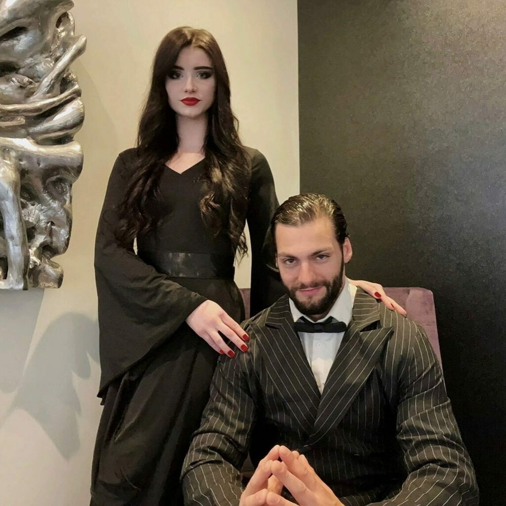 JonReeseHealth's tweet photo. “When we’re together darling, every night is Halloween.” 💀🖤

Happy Halloween from Cara Mia and I. Hope it was absolutely dreadful 🥀⚰️

#halloween2021 #happyhalloween 
#halloweeniseveryday 
#halloweeneveryday 
#cosplay 
#morticiaandgomez 
#addamsfamil… https://t.co/nptdOjXK1V https://t.co/3ae0KuMmhl