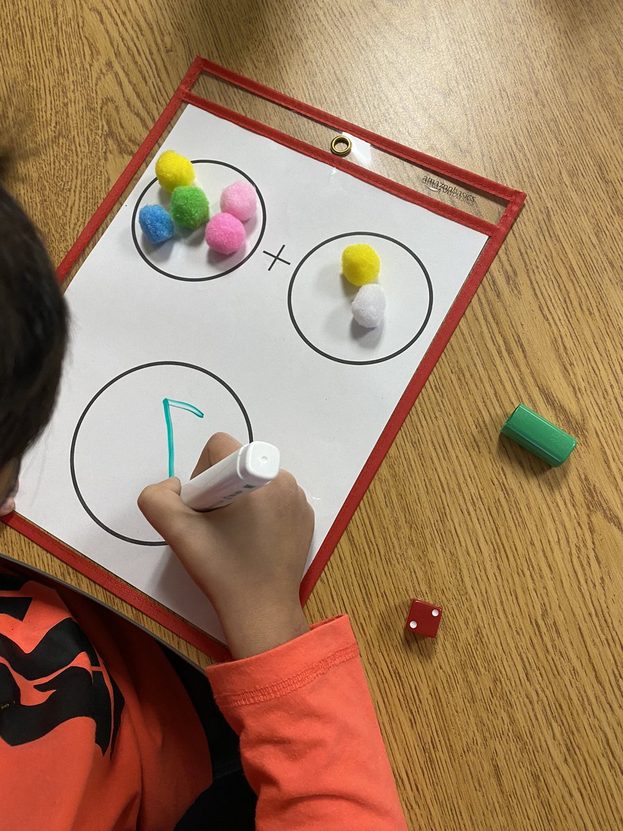 heatherimrie's tweet photo. We are adding 2 new activities to our math centres! Today, we learned how to do the activities. 

1. Roll a die and add that many pompoms to circle #1. Repeat for #2. Add the pompoms together to get your total!

2. Spill a cup of 10 chips. Place them on a ten frame to make 10! https://t.co/VPt1EoHVs3