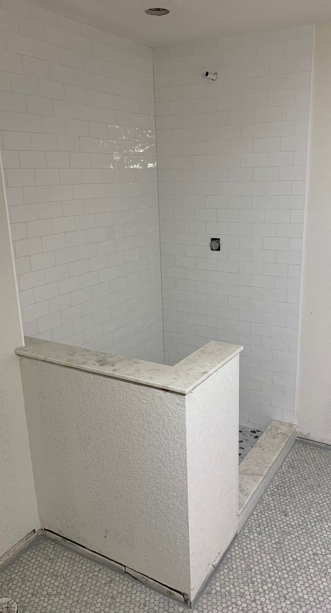 tiling_expert's tweet photo. Schluter shower pan with mosaic tiles on it. Subway tile in the shower surround with schluters on all open edges. Solid surfaces on the curb, bench, and the pony wall. Mosaic tiles on the bathroom floor.

#experttouchtiling #denvertiles #showers #mosaictiles https://t.co/M4d5XkdjZj