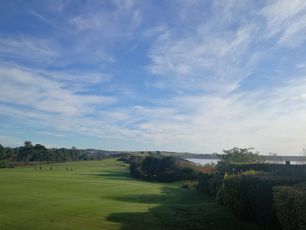 Beautiful day for a round of golf. Blue skies, sparkling seas and perfect greens.