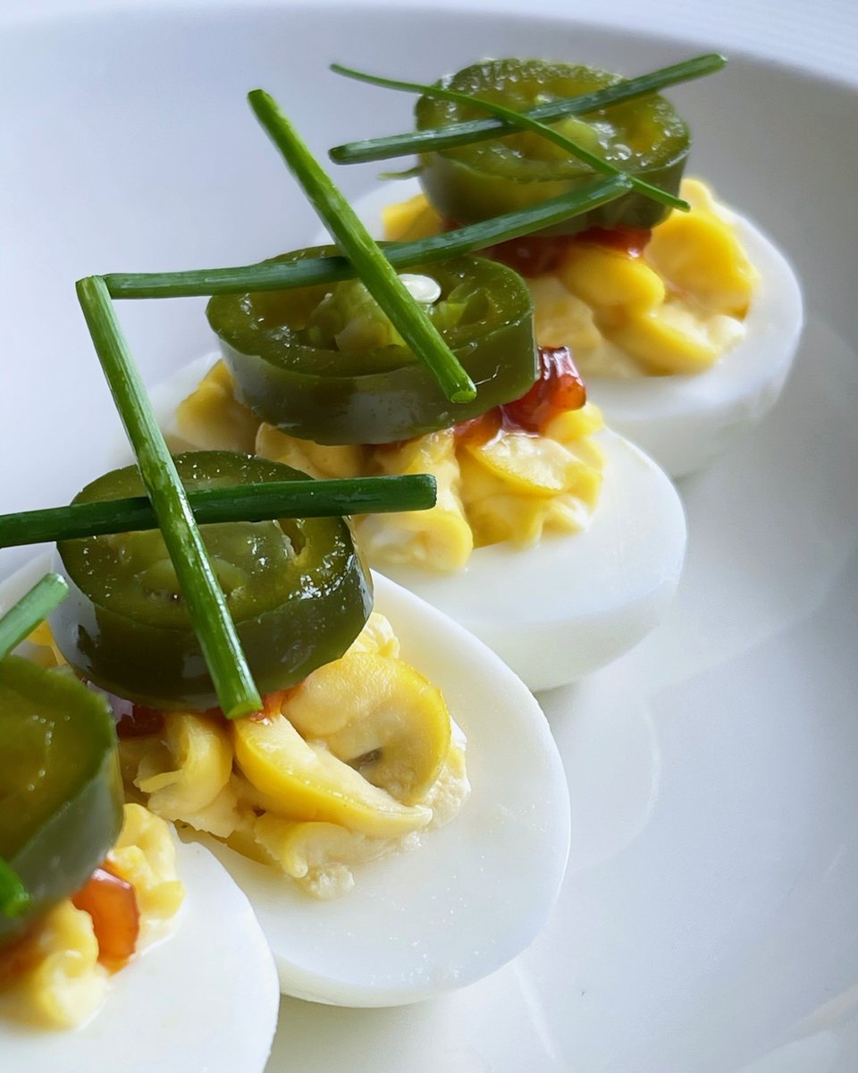 Did you know that today is #nationaldeviledeggday??  What a better way to celebrate than with these egg-ceptional beauties from <a href="/dinethekitchen/">The Kitchen</a> and @chefaustinsimmons. Topped with a slice of candied jalapeno, it'll give you the sweet spice you need to get through a Tuesday.