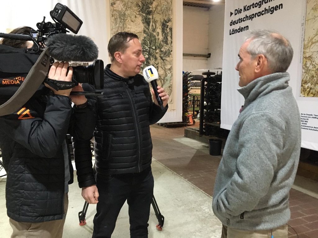 DMFF_eu's tweet photo. The Mapping the Mountains exhibition officially opened at 5:00 PM and tv station L1 was there. The fascinating exhibition on mountain cartography can be seen in Aachen until 30 November this year. Are you going to take a look?

#DMFF #Mappingthemountains #expositie #Aachen https://t.co/undsR0wDQZ