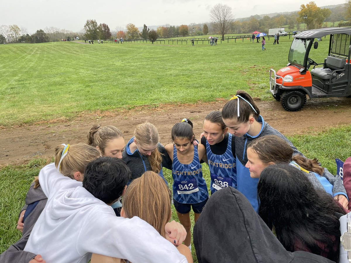Girls team huddle w/ Arnav