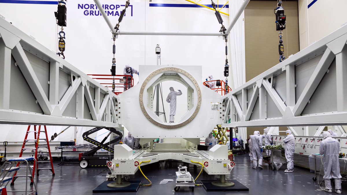 Webb telescope technicians inspect a high-capacity roll-over fixture (a critical component in transporting the observatory) in the Northrop Grumman cleanroom.